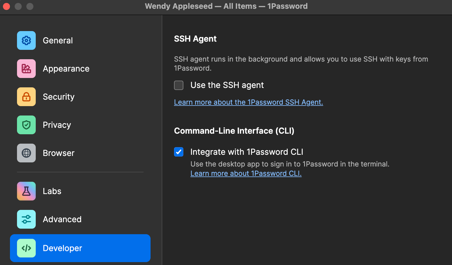 The 1Password Developer settings pane with the Integrate with 1Password CLI option selected.