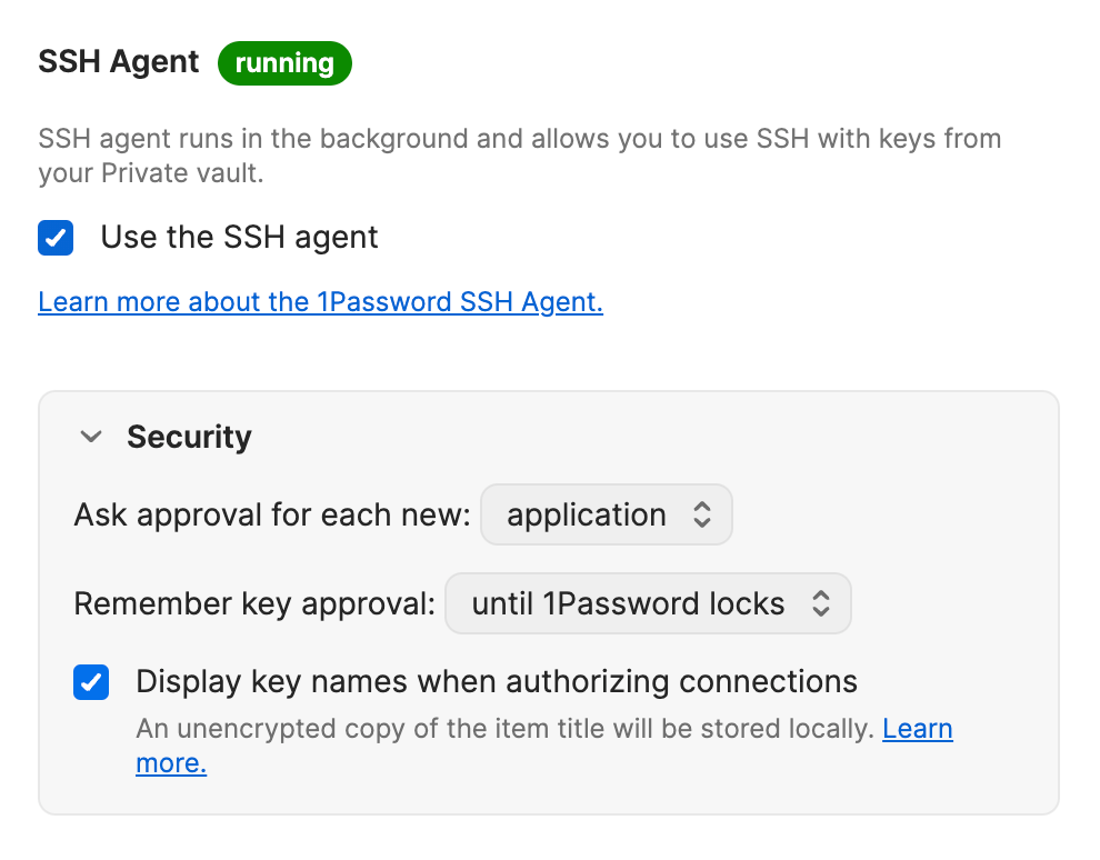 The SSH agent developer settings in the 1Password desktop app, with both checkboxes selected and a badge at the top that shows the agent is running.